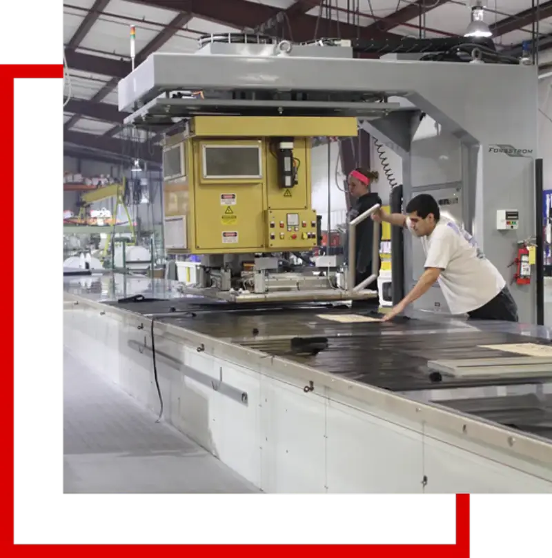 RF welding machine at Delange's Industries fabrication shop Technician working